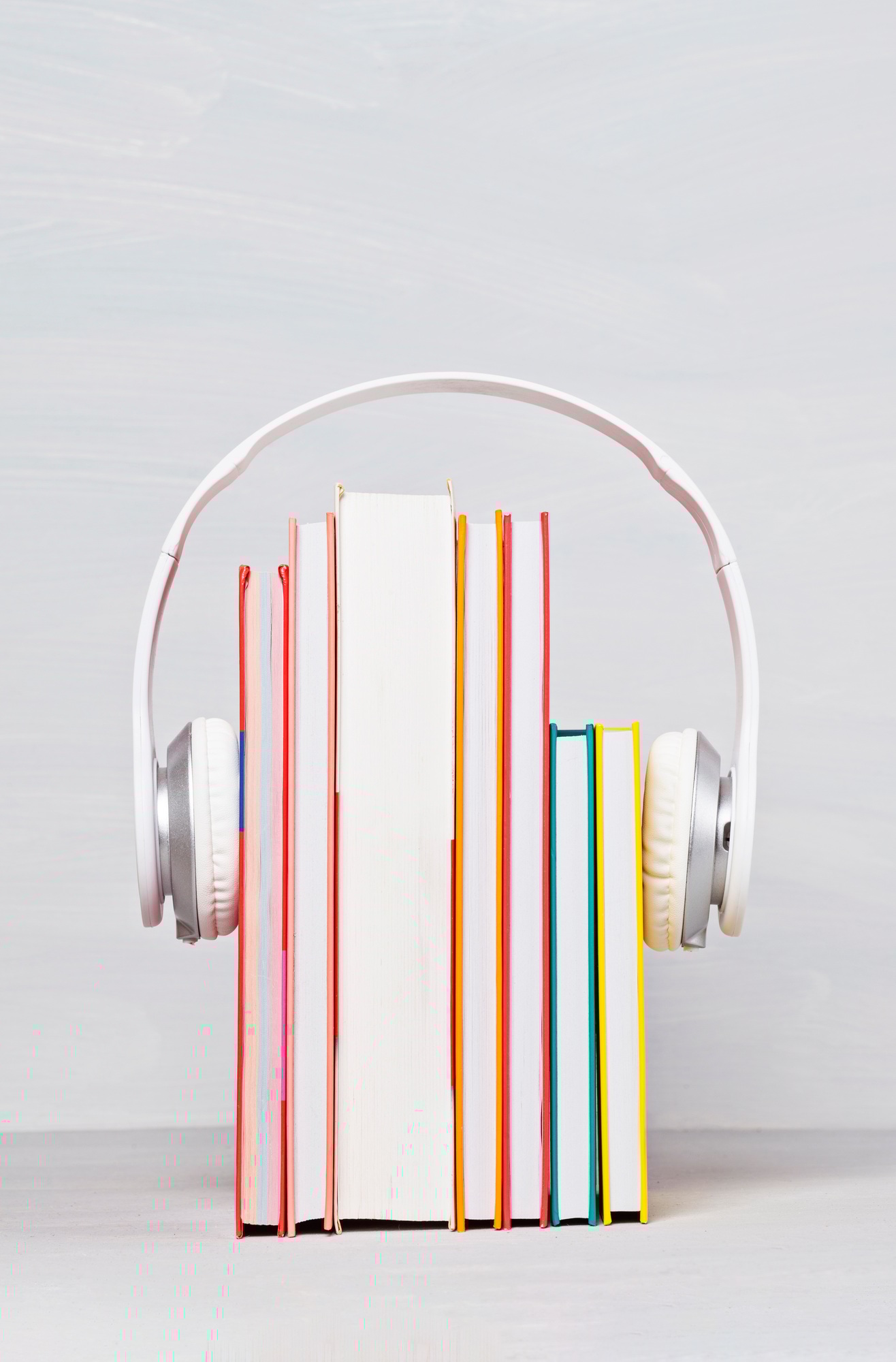 Group of books with the earphones. Audiobooks concept